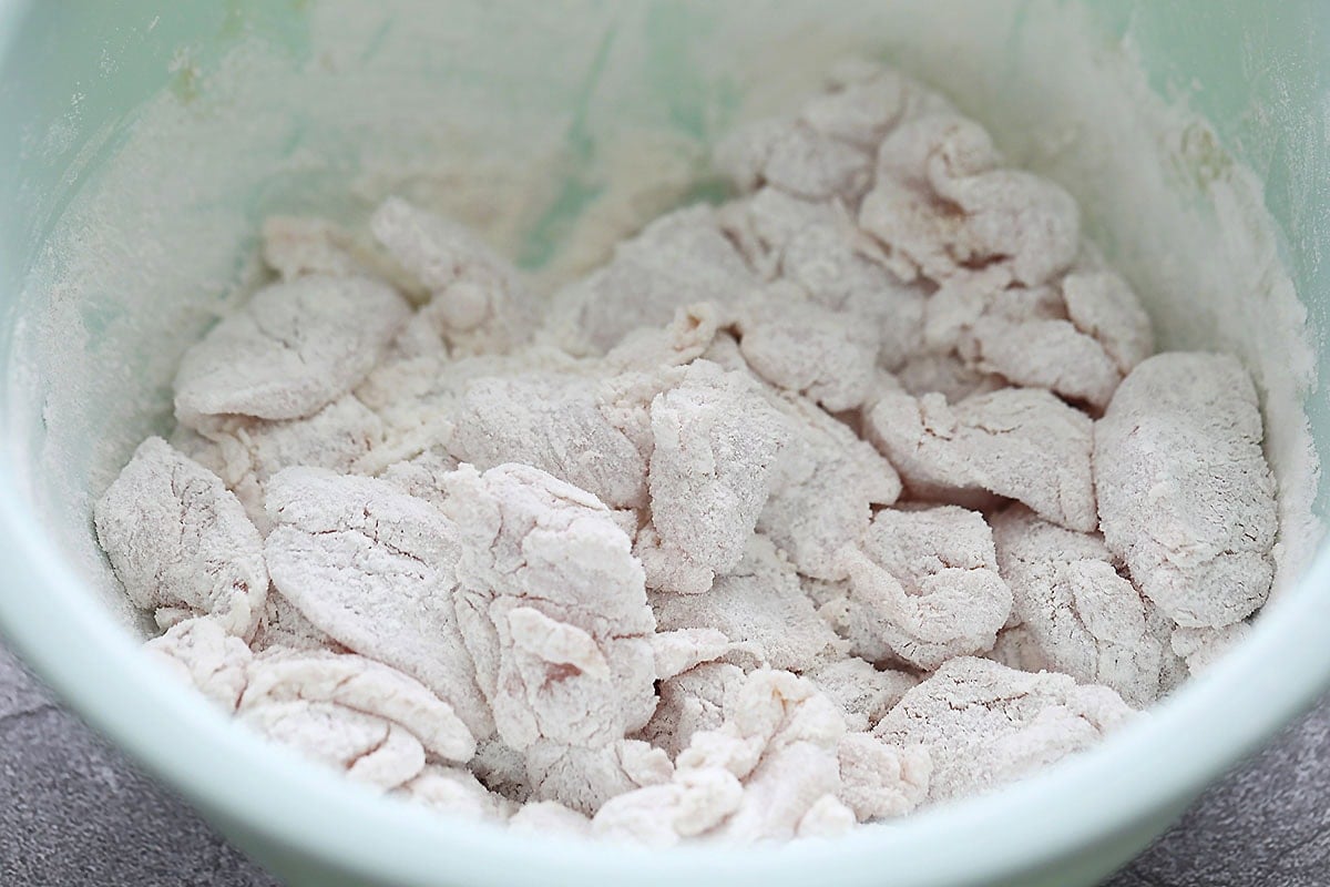 Marinated chicken coated in cornstarch and all-purpose flour.