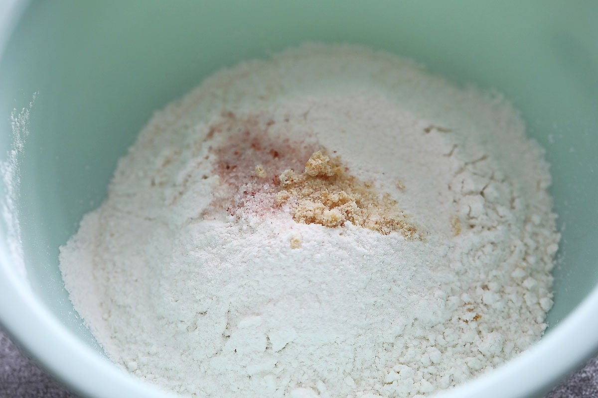 Flour, chicken bouillon and salt in a bowl.