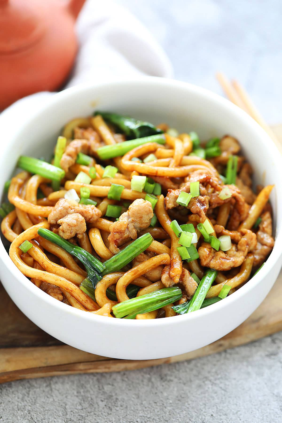 Shanghai fried noodles topped with scallions.