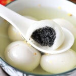 Easy Chinese dessert black sesame dumpling served with ginger syrup.