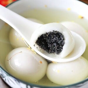 Easy Chinese dessert black sesame dumpling served with ginger syrup.