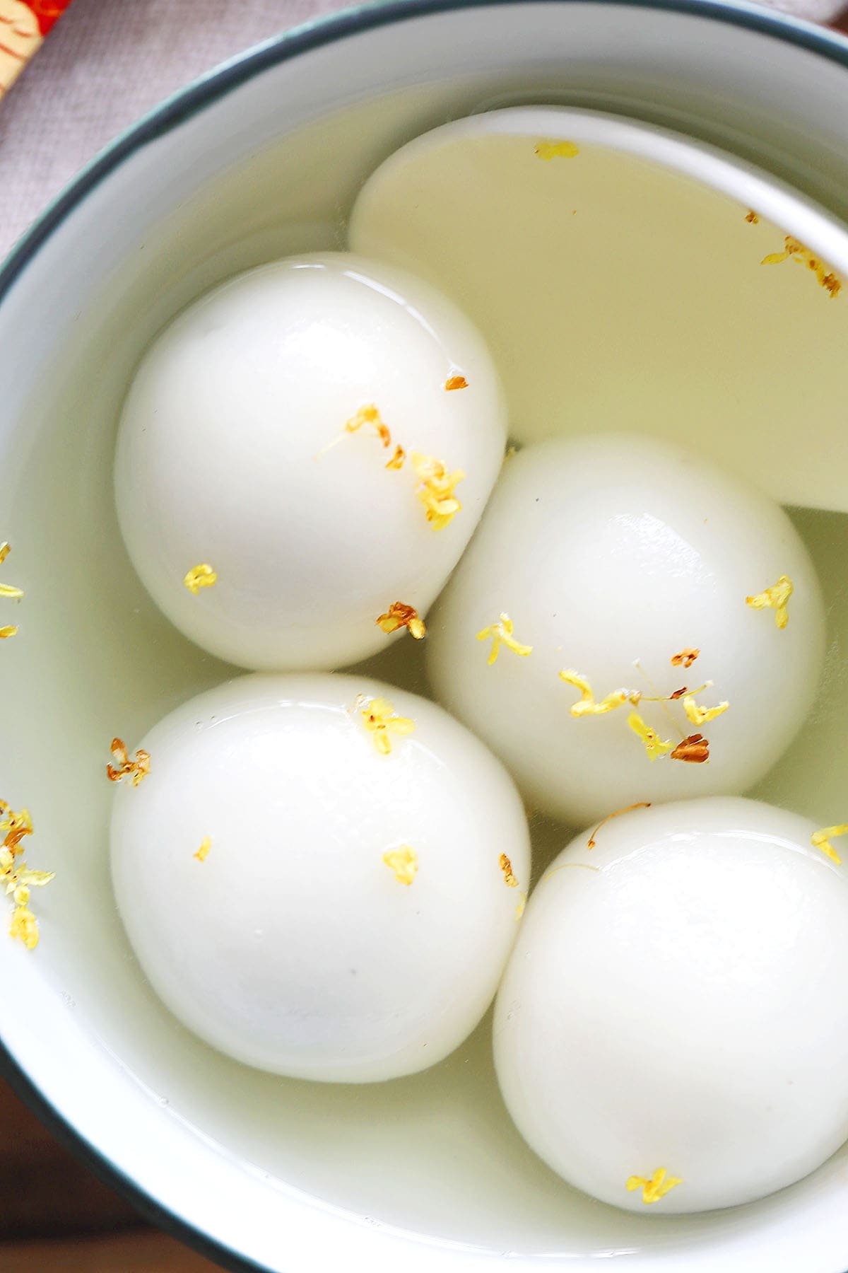 Black sesame glutinous rice balls in sweet ginger soup.