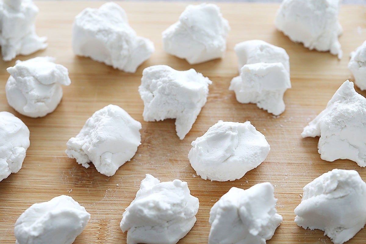 Portioned tang yuan dough on a board.