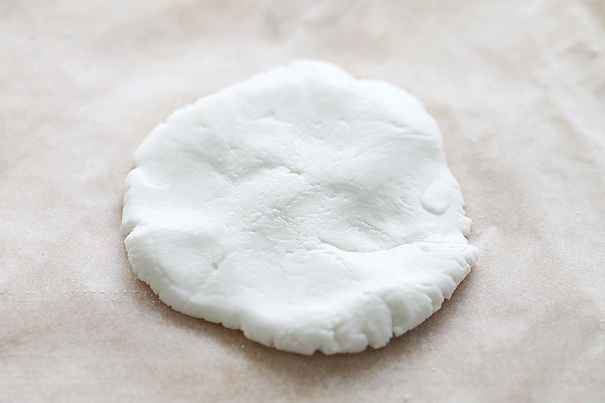 Flattened tang yuan dough on parchment paper.