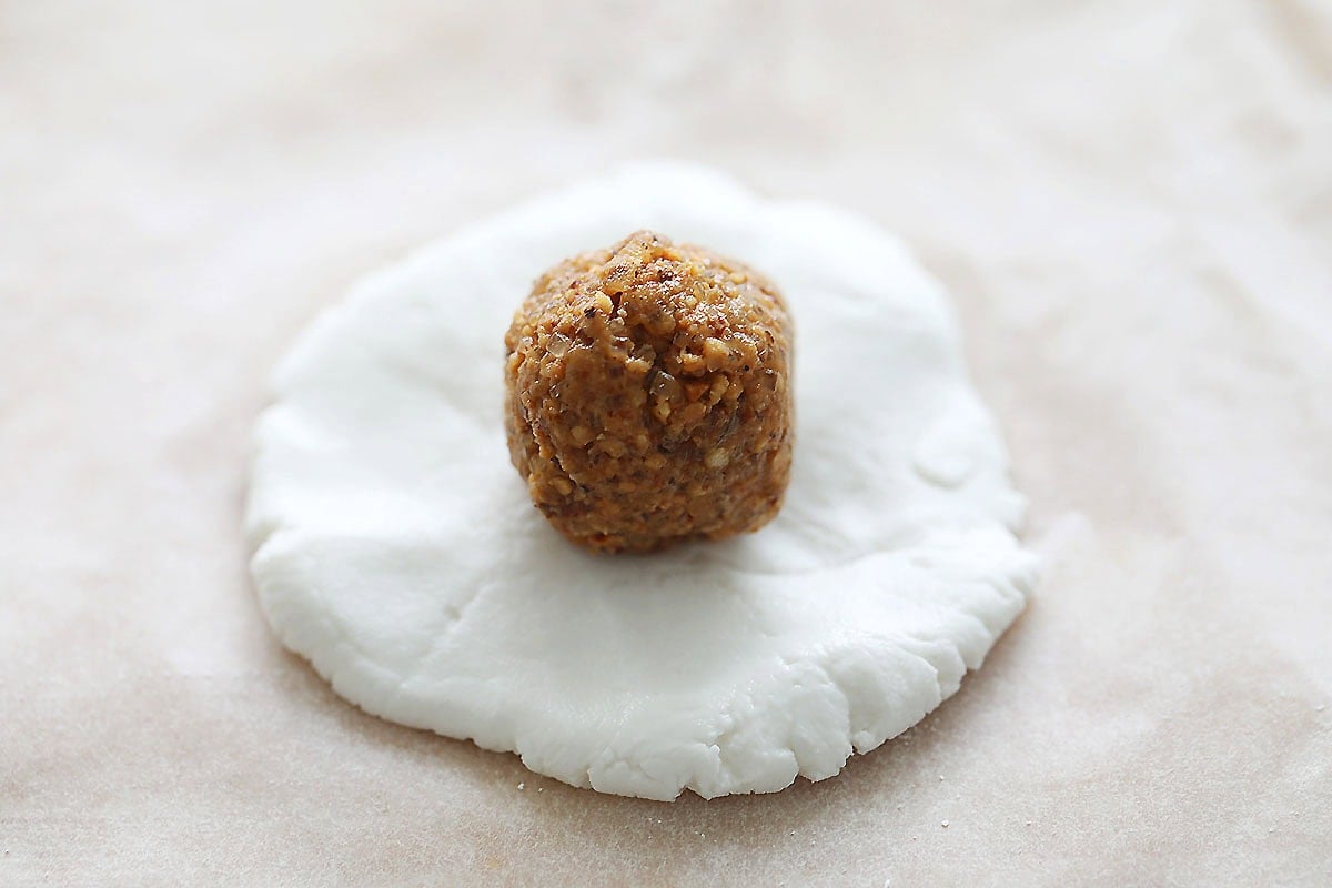 Peanut filling on flattened glutinous rice dough.