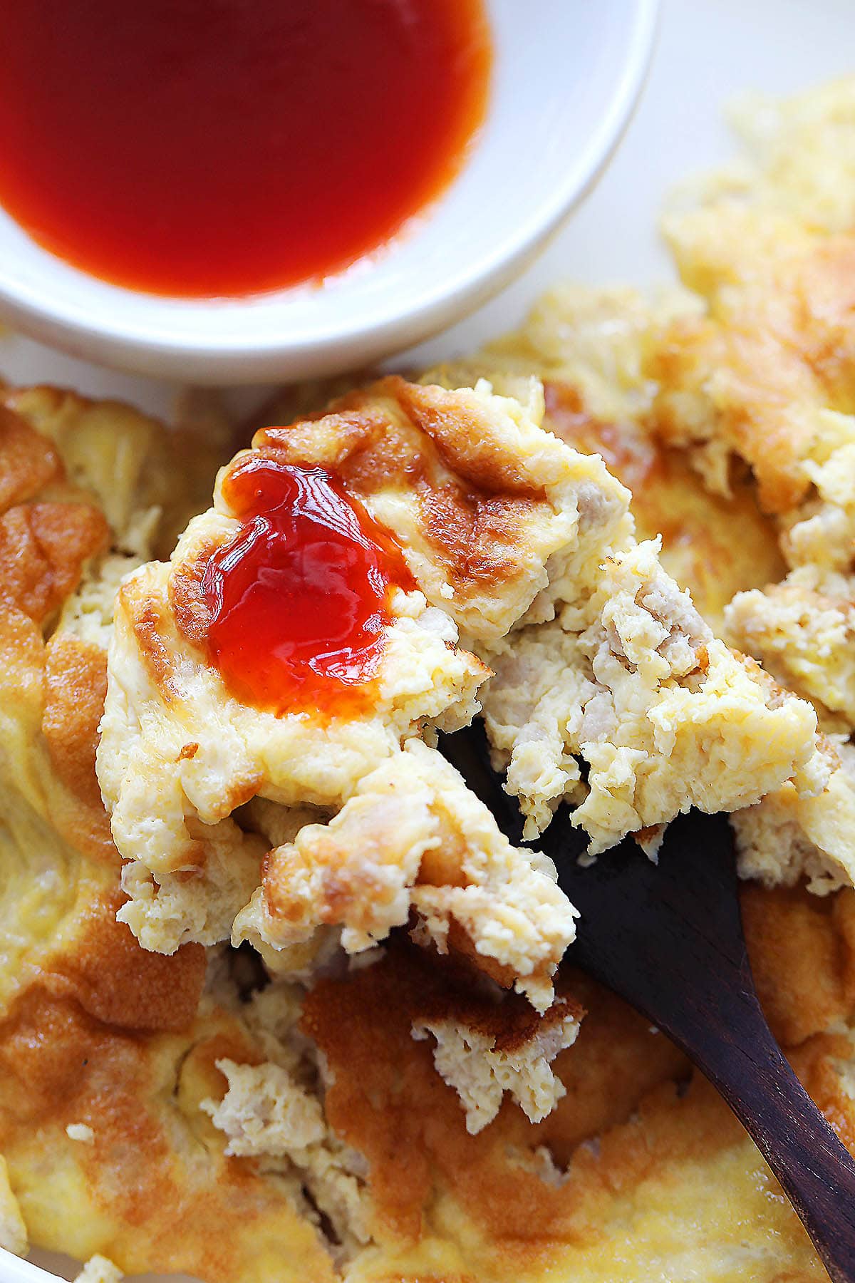 Thai pork omelette dipped in chili sauce.