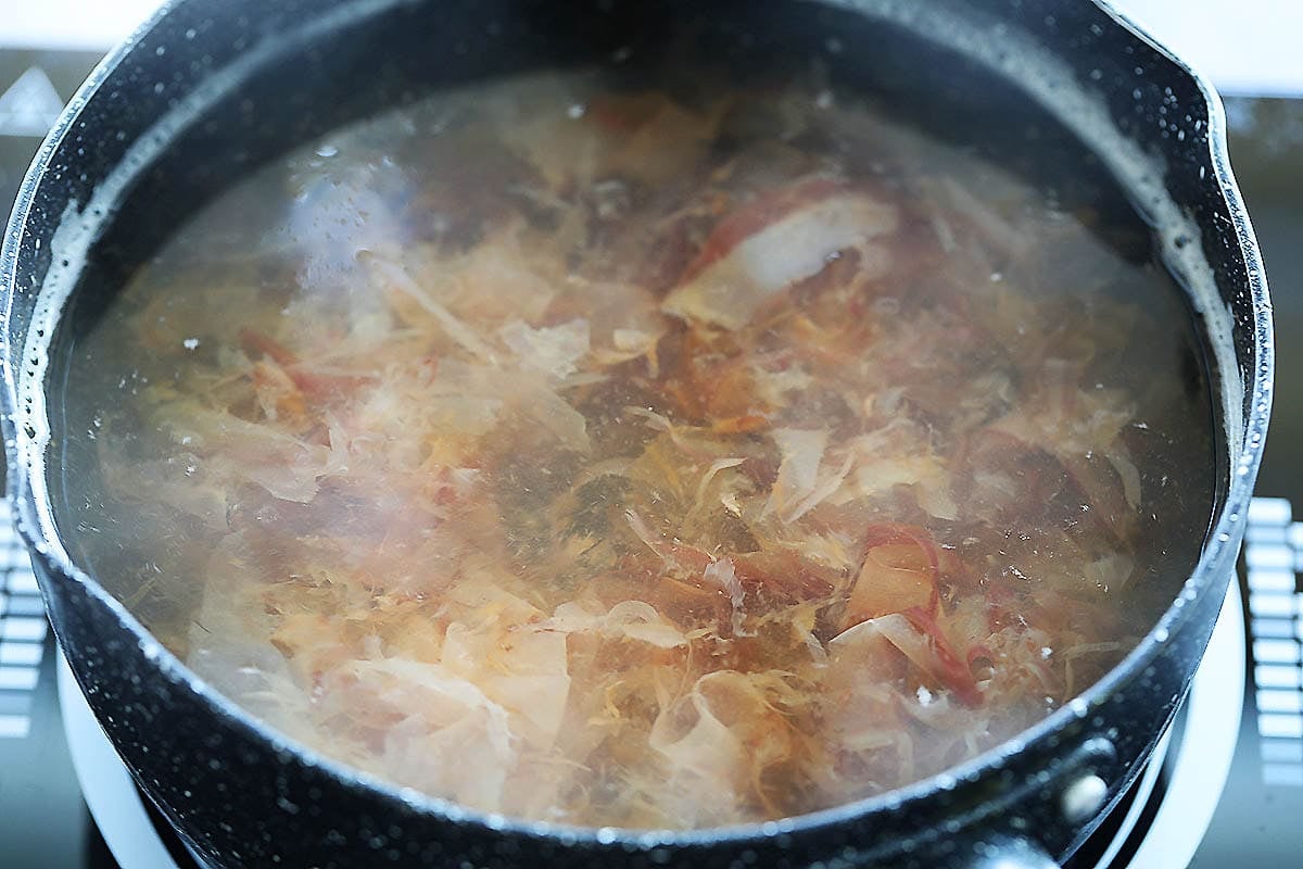 Bonito flakes in a pot of water.