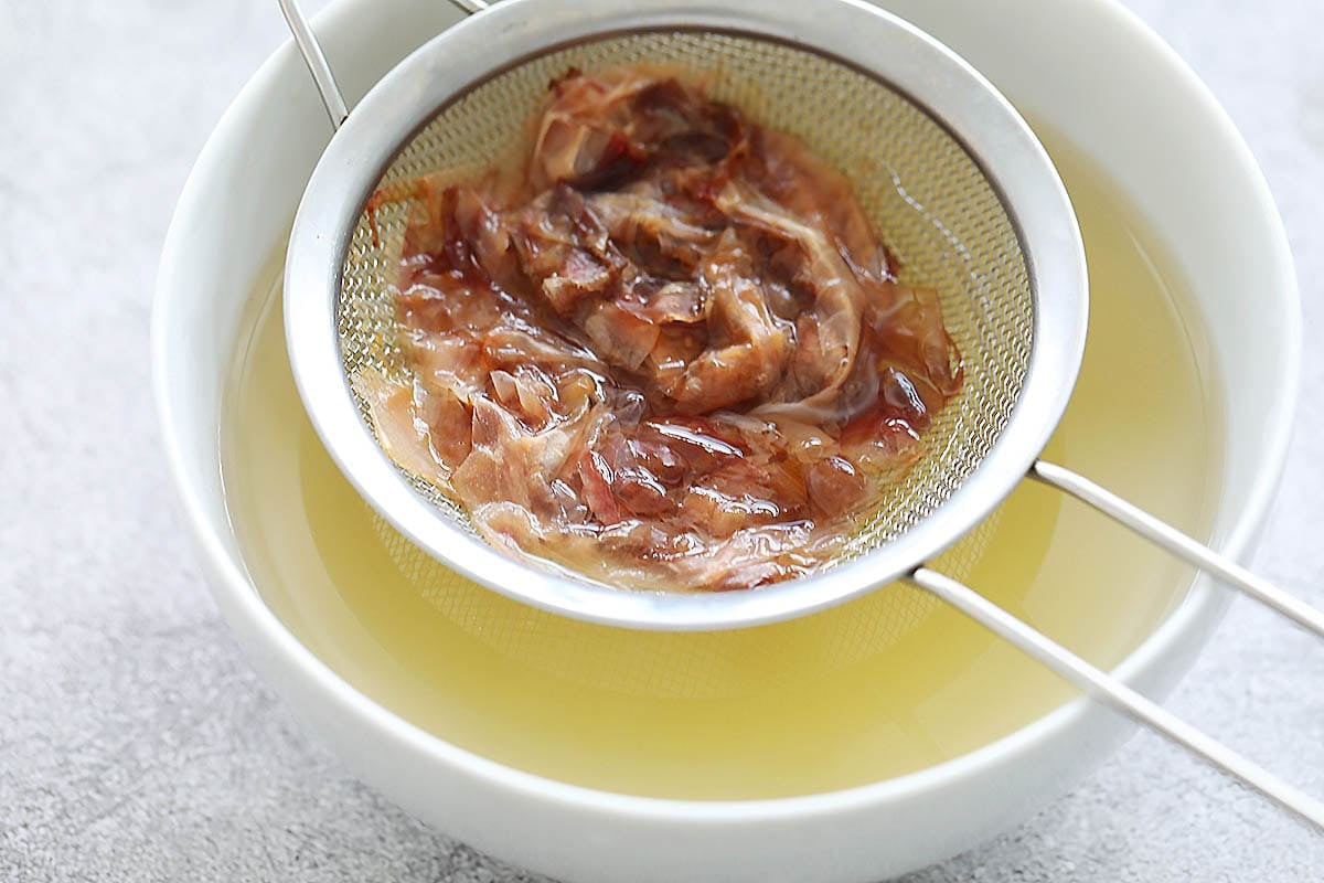 Japanese soup stocked strained into a bowl.