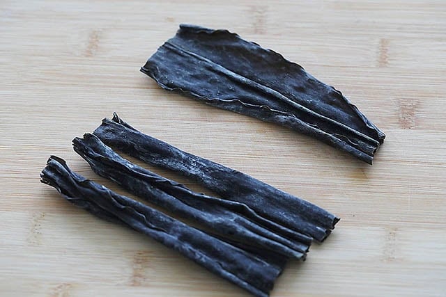 Kombu on a chopping board.