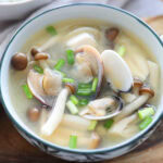 Miso clams with soup (asari miso soup) garnished with scallions.