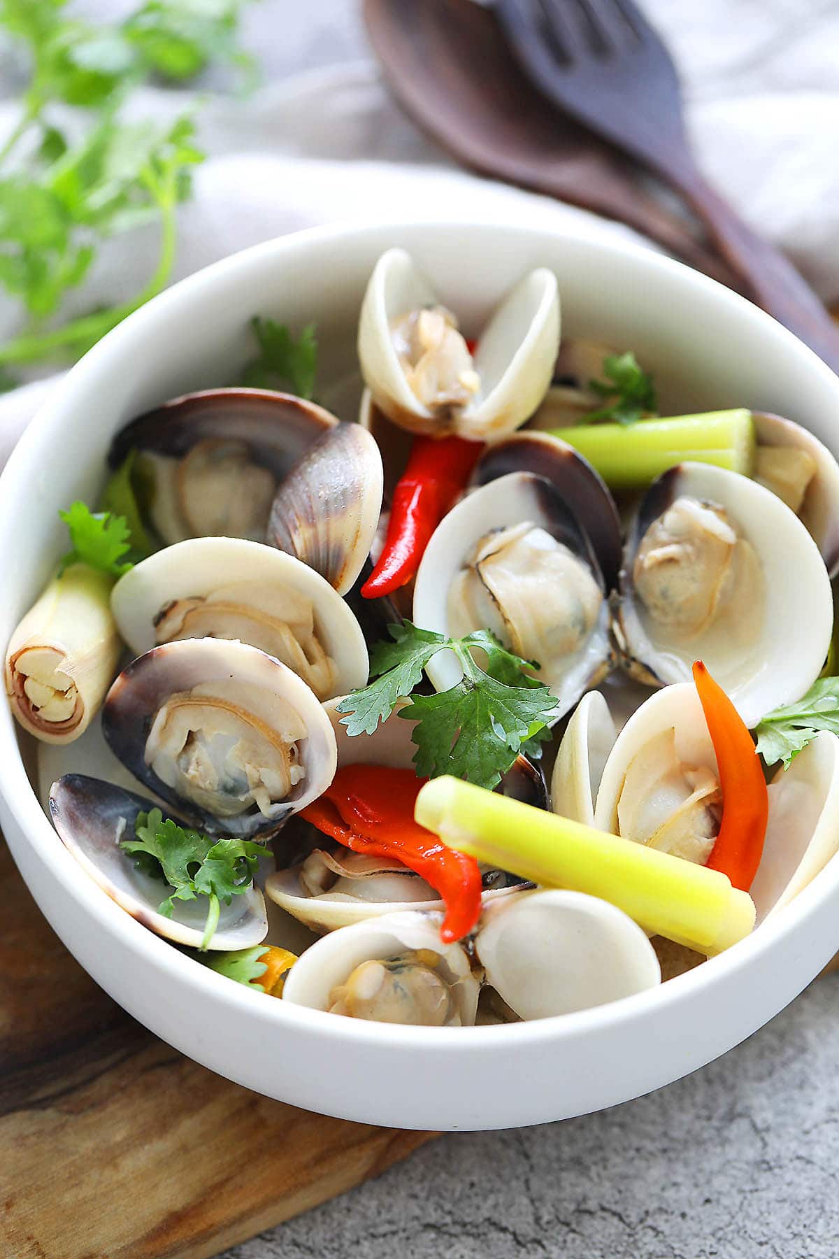 Thai steamed clams garnished with cilantro.