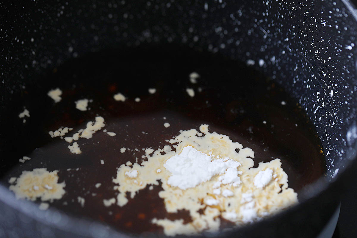 Ingredients for general tso sauce in a saucepan.