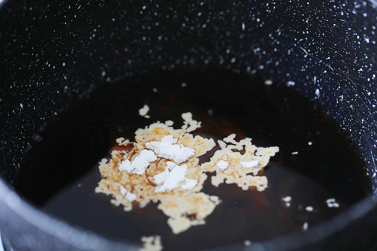 Cornstarch, water, and soy sauce in a sauce pan.