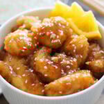 Crispy orange chicken with homemade orange sauce served in a bowl.