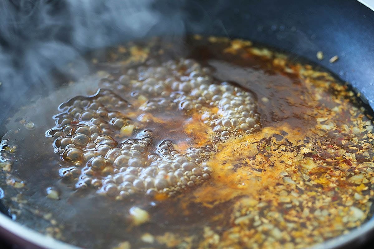 Orange sauce in a skillet.