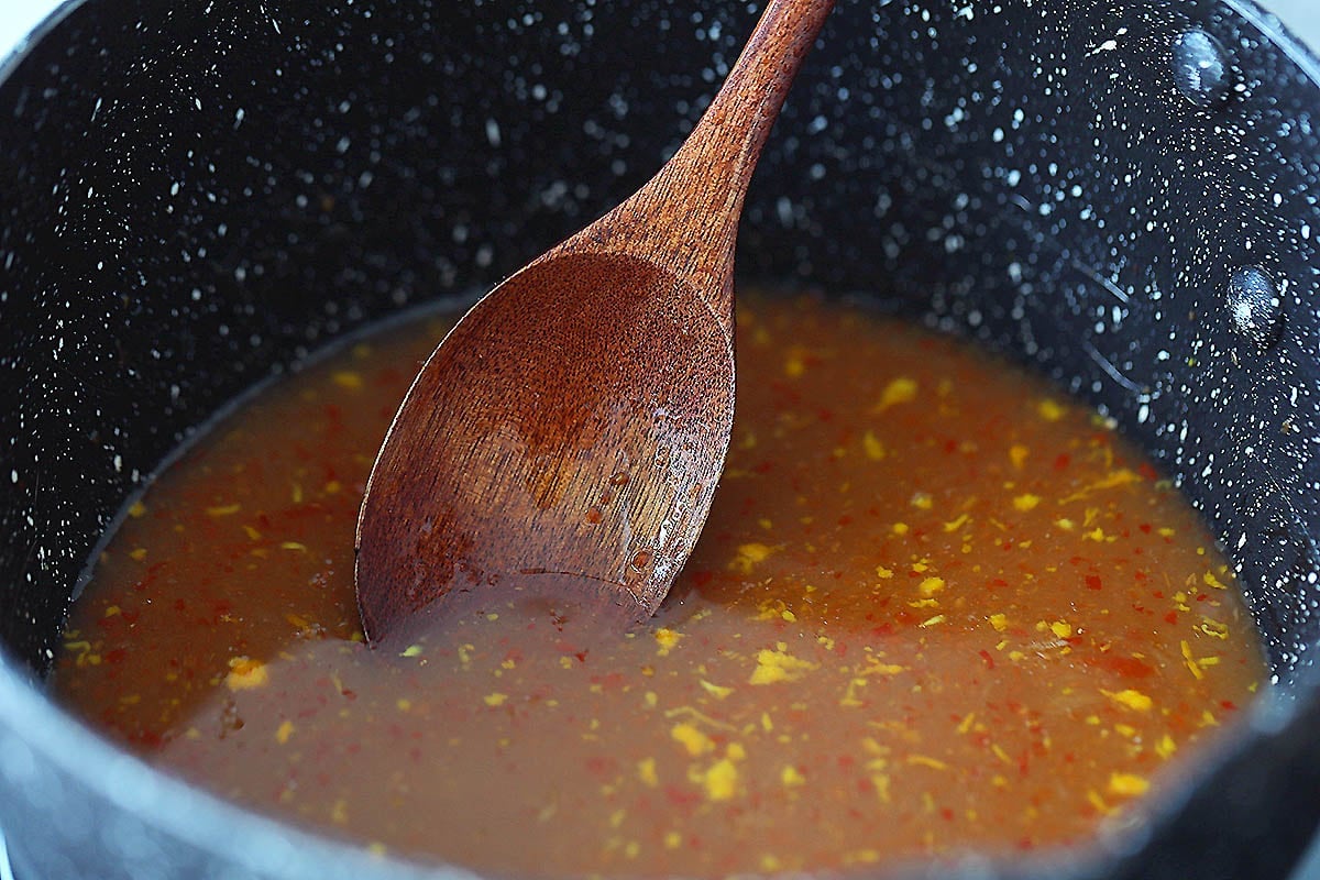 Easy orange sauce recipe in a saucepan.