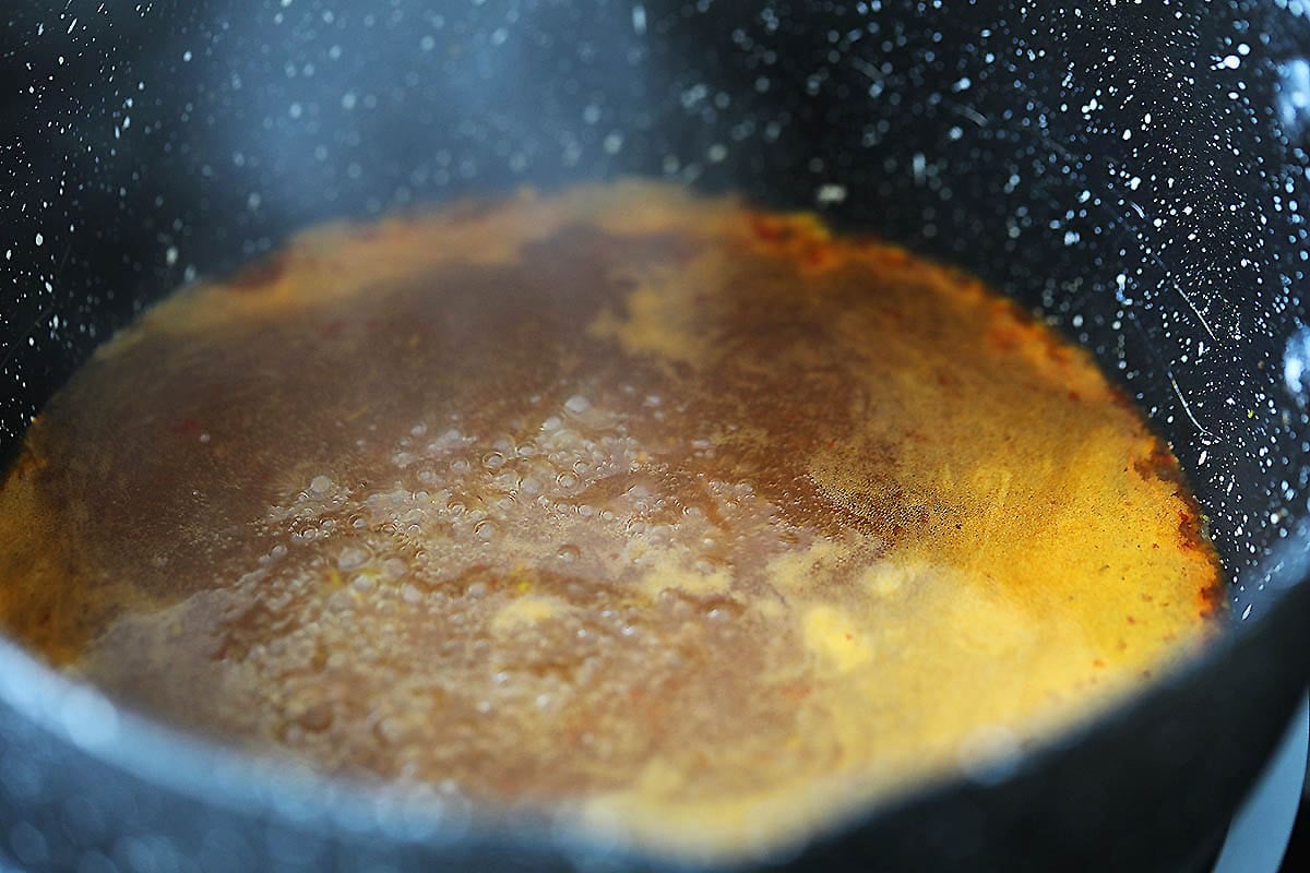 Sauce simmering in a saucepan.