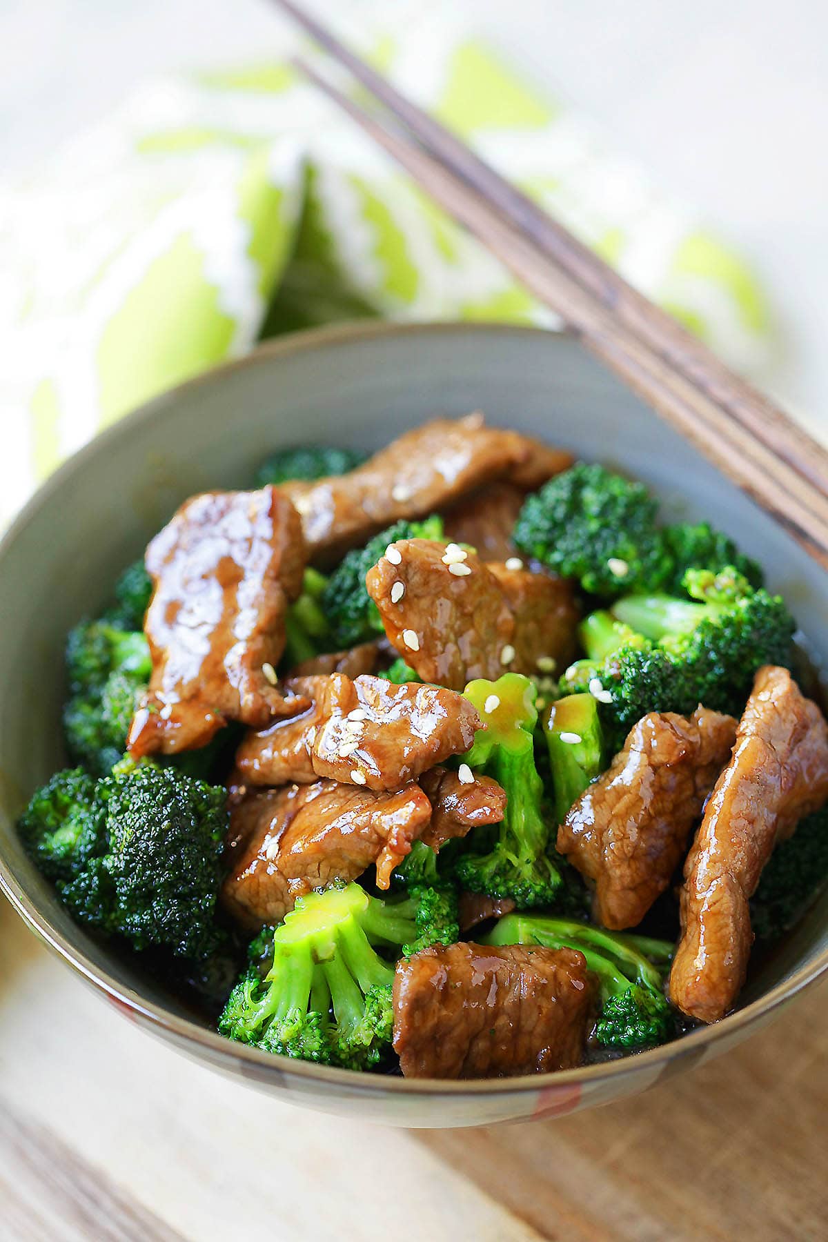 Chinese beef and broccoli topped with white sesame seeds.