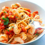 Authentic Italian shrimp pasta recipe made with tomatoes and garlic.