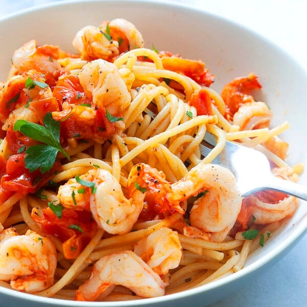 Authentic Italian shrimp pasta recipe made with tomatoes and garlic.