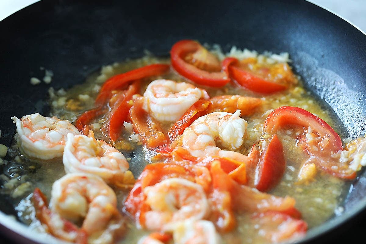 Shrimp and red sauce in a pan.