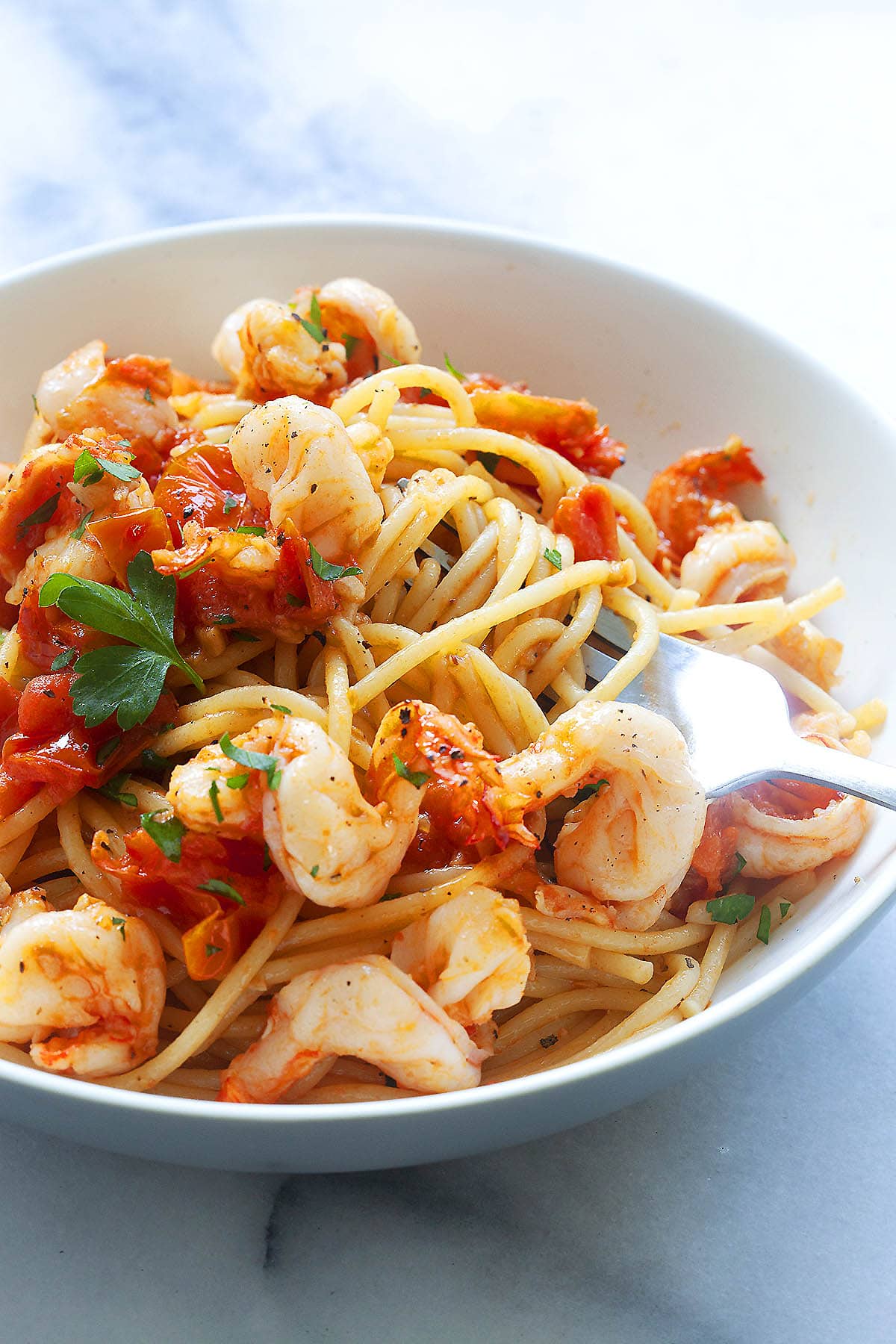 Authentic Italian shrimp pasta recipe made with tomatoes and garlic.