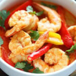 Authentic Thai red curry shrimp served in a bowl.