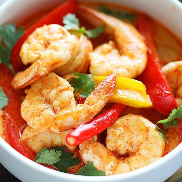 Authentic Thai red curry shrimp served in a bowl.