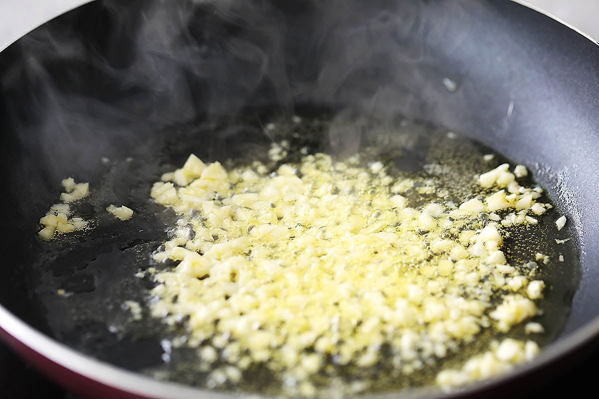 Garlic and melted butter in a skillet.
