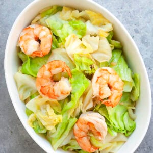 Sauteed cabbage with garlic and shrimp served in a deep dish.