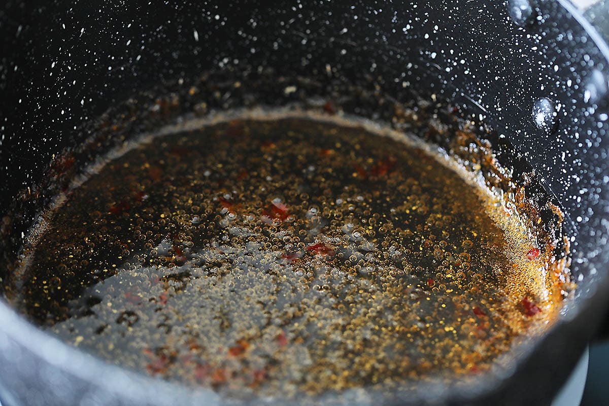 Thai dressing for cucumber salad in a saucepan.