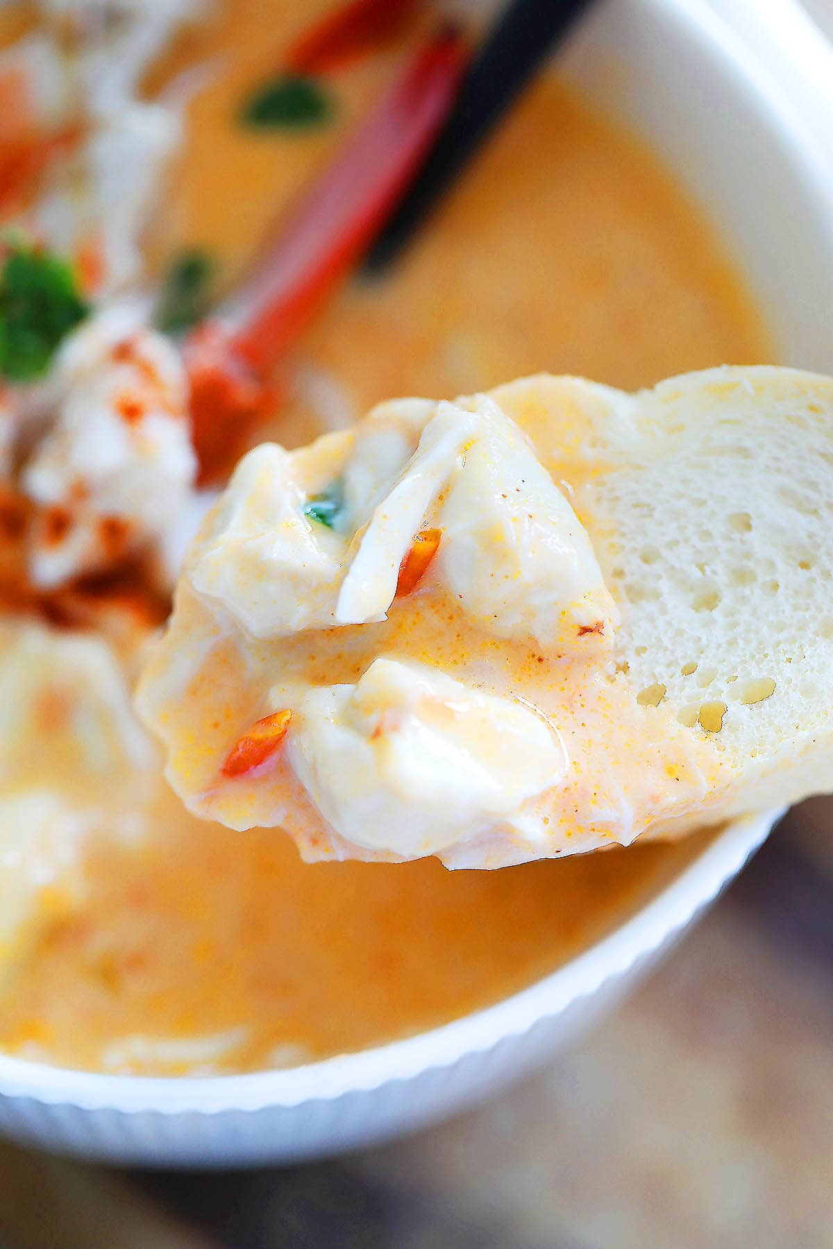Crusty French bread dipped in crab bisque and with lump crab meat on top.