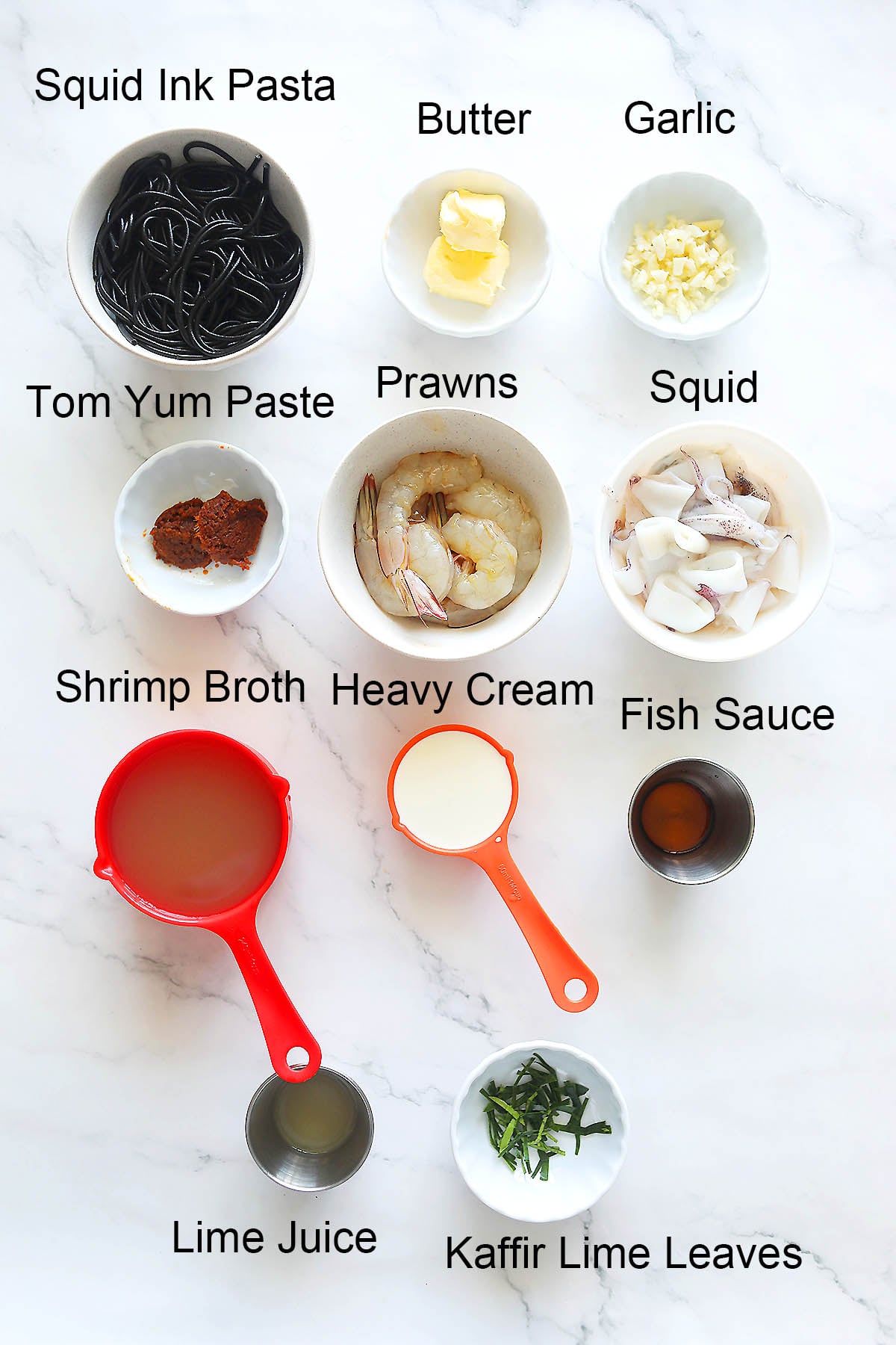 Ingredients for seafood squid ink pasta.