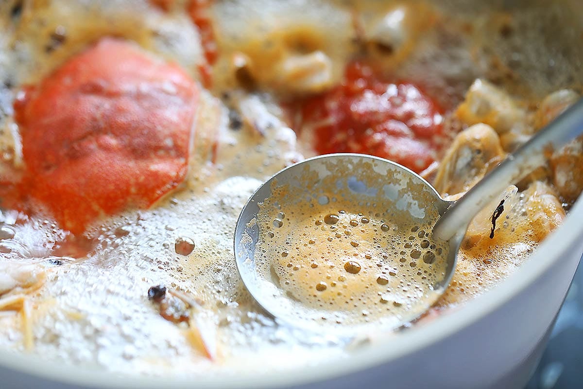 A spoonful of foam from the broth.
