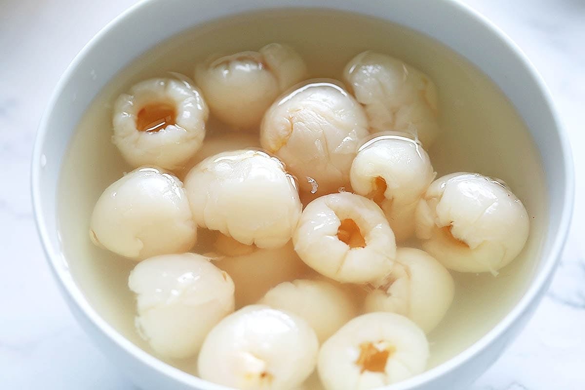 Canned lychee in syrup in a bowl.