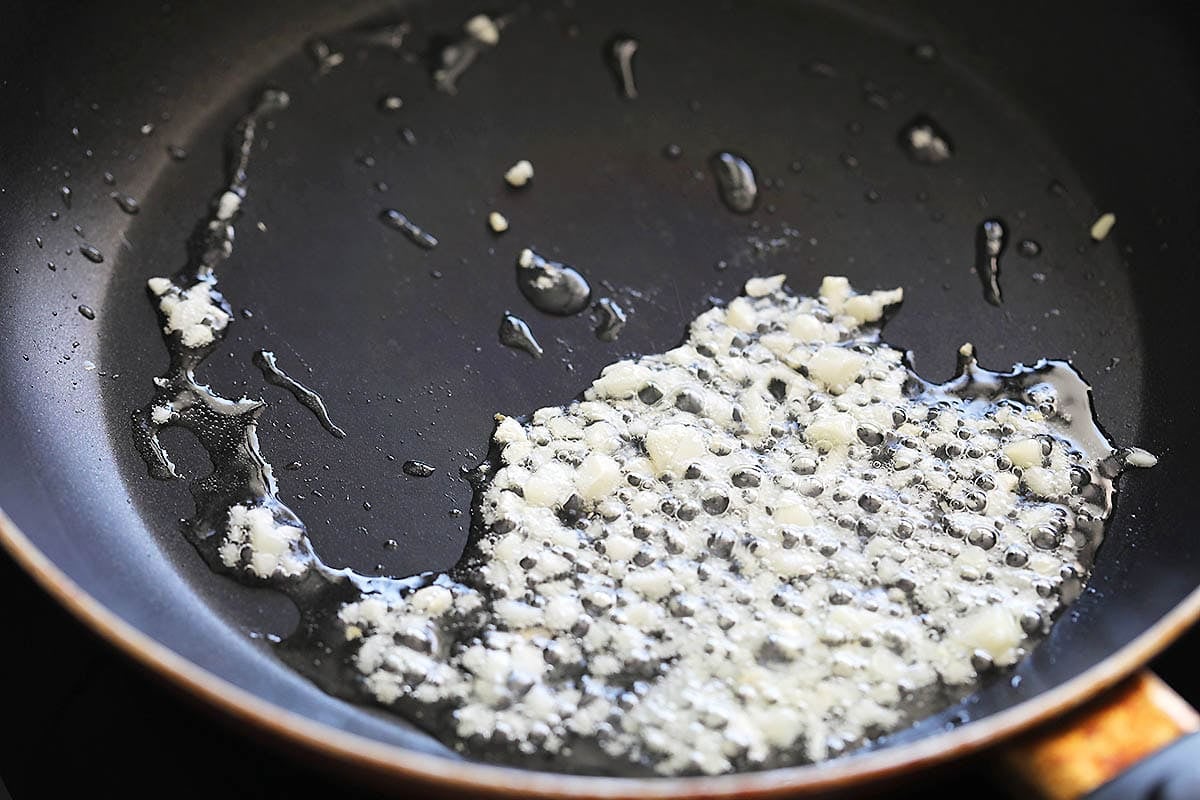 Minced garlic and oil in a pan.