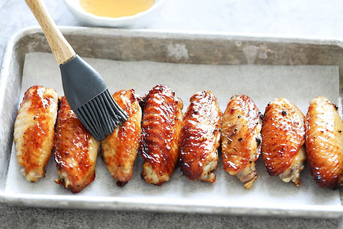 Golden chicken wings brushed with honey.