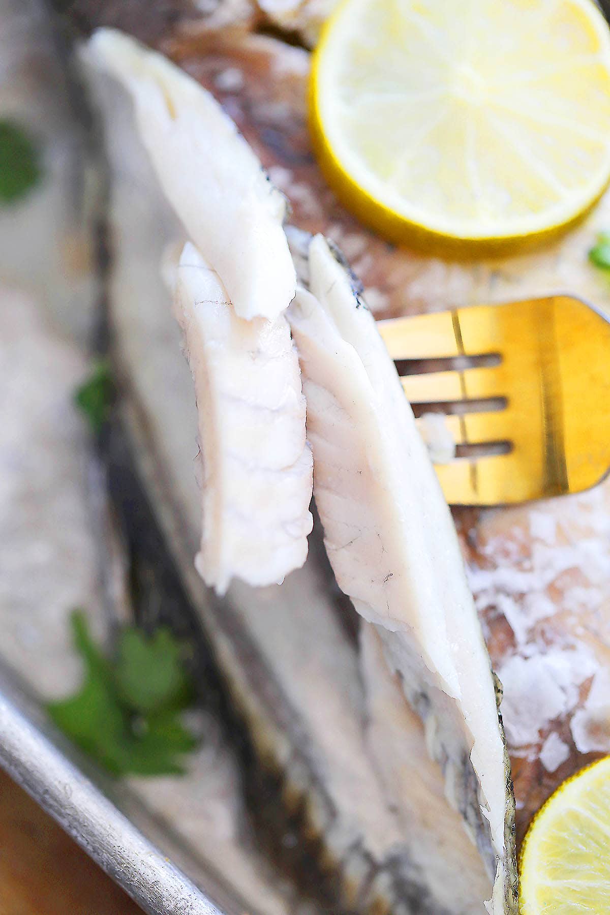 Thai salt baked fish stuffed with garlic and lime slices.