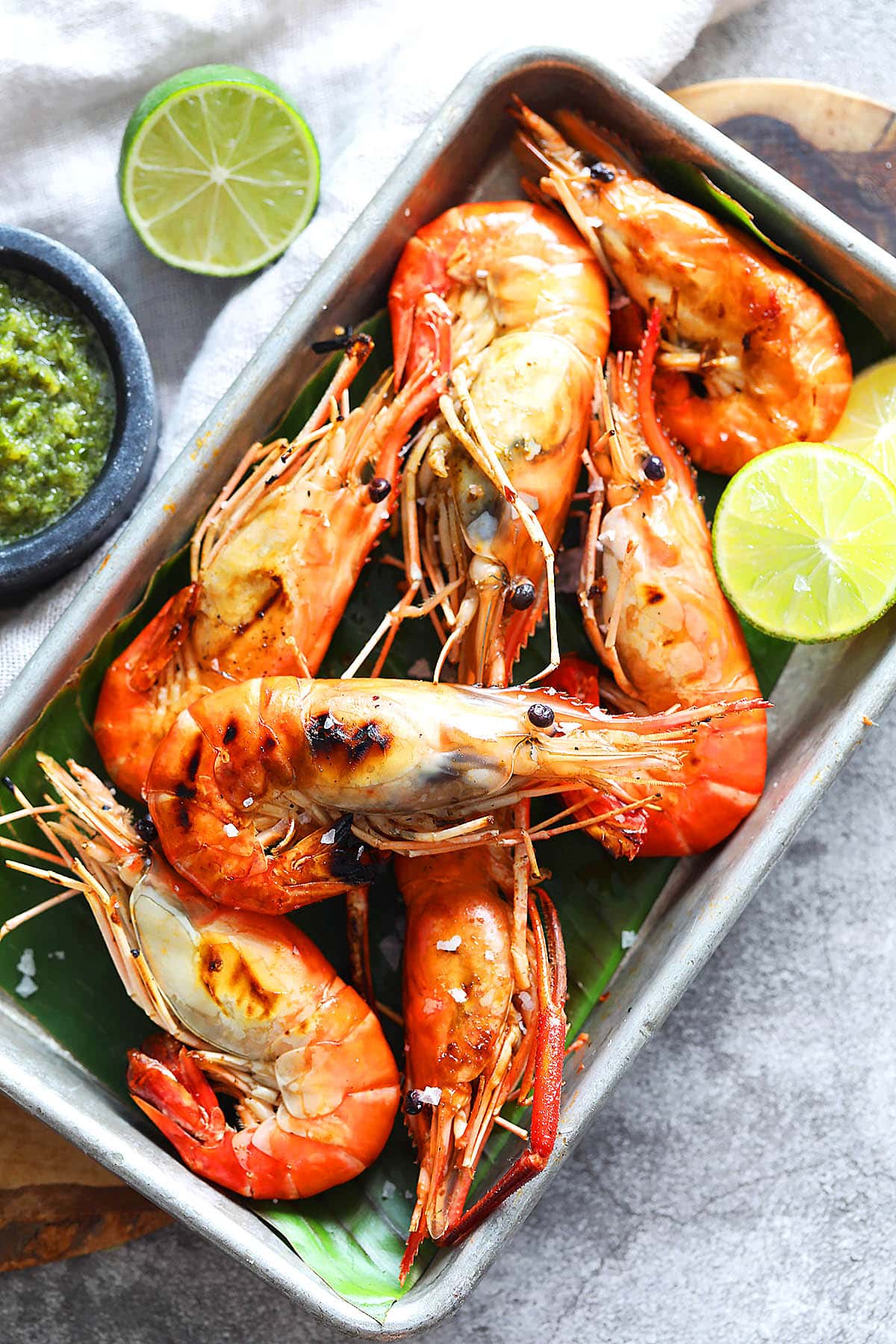 Thai grilled prawn served with homemade Thai seafood sauce and lime wedges.