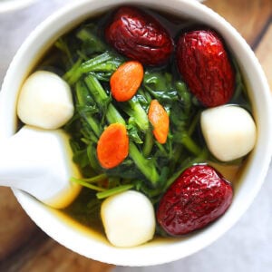Chinese style watercress soup served in a bowl.