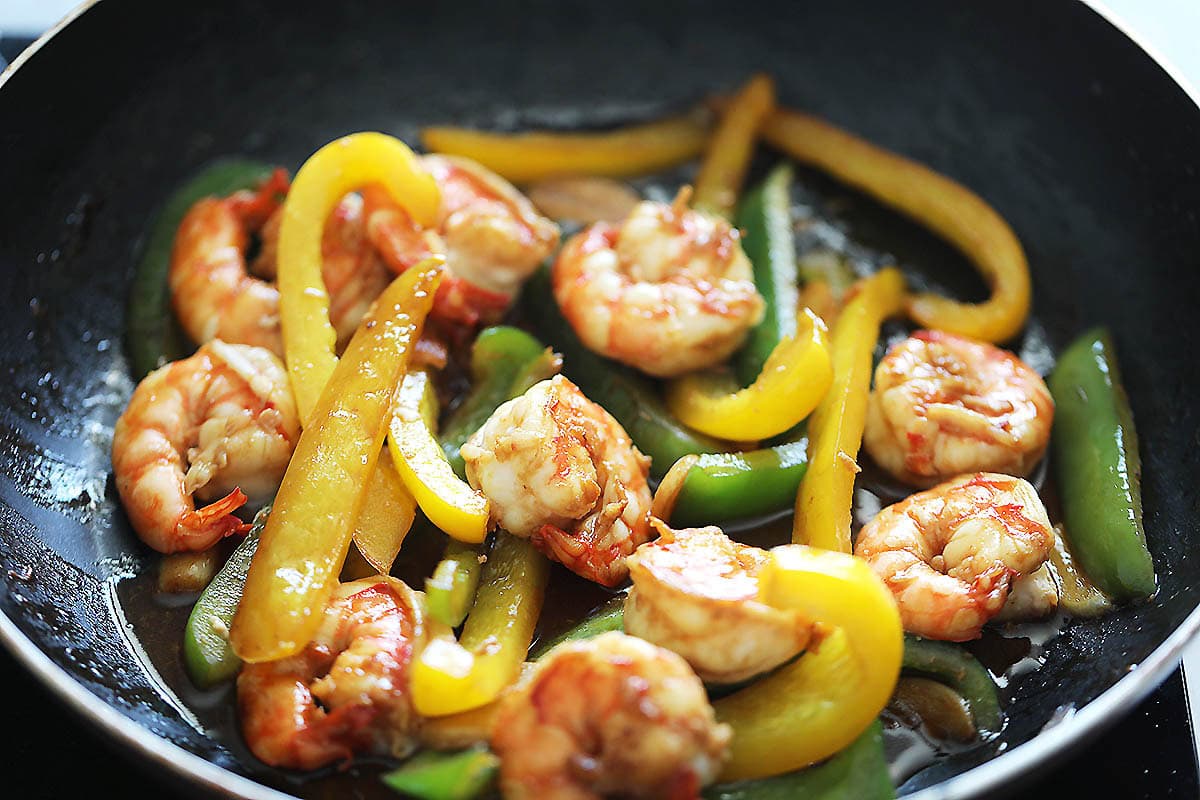 Bell peppers and shrimp coated in a savory sauce.