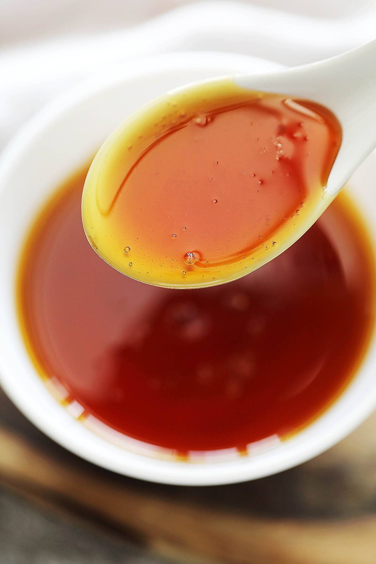 A spoonful of dark amber caramel.