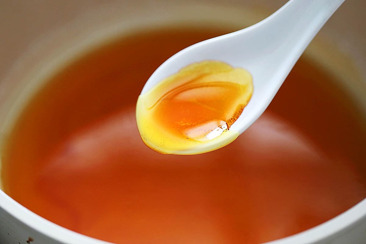 A spoonful of golden amber caramel.