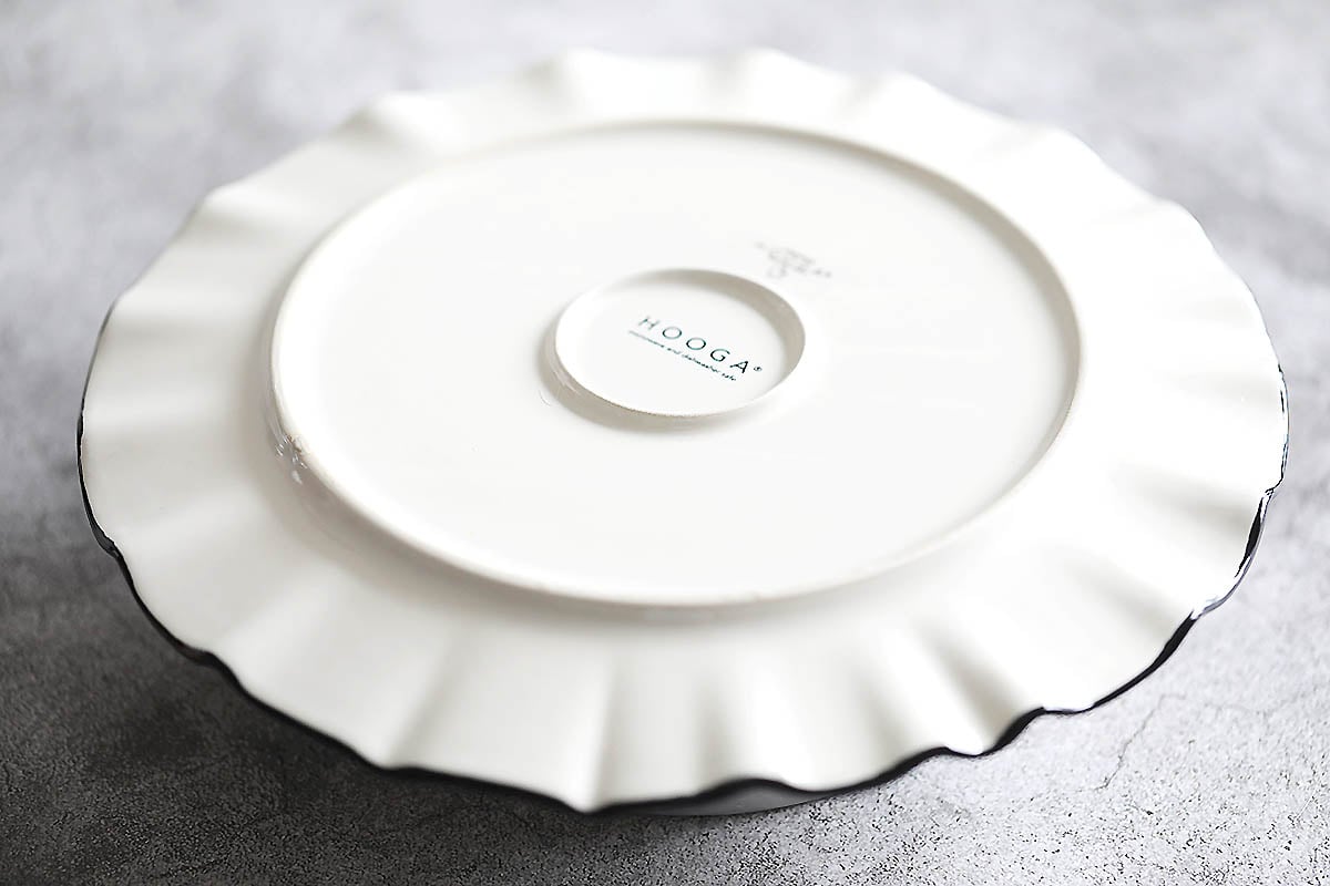 Upside down serving plate on a cake pan.