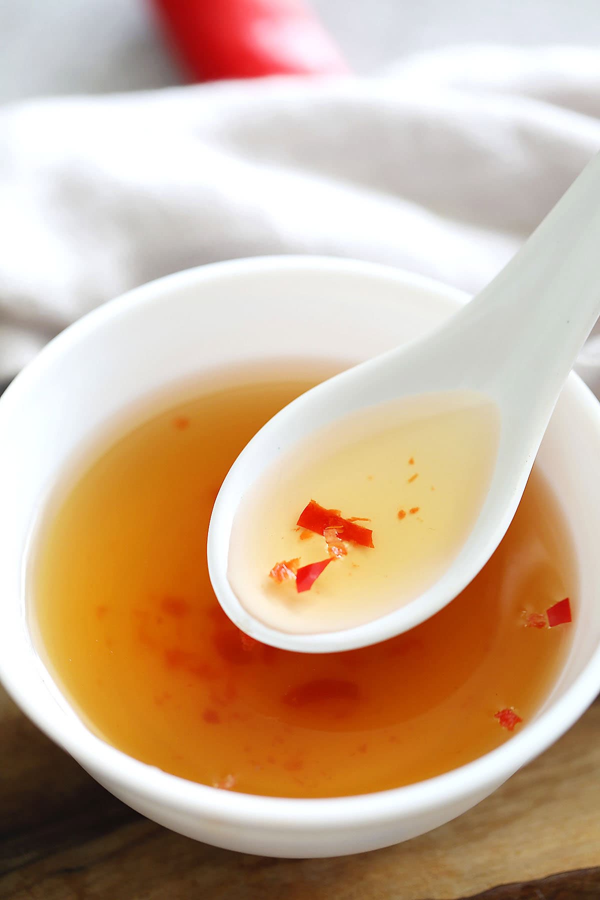 A spoonful of Vietnamese dipping sauce.