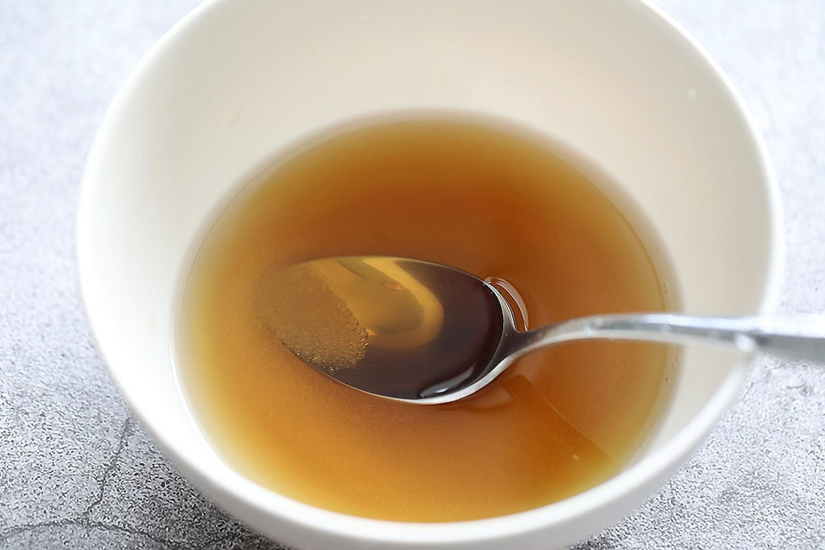 Fish sauce, water, and sugar in a bowl.
