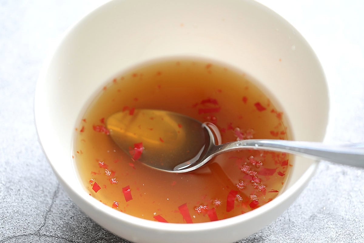 Nuoc cham recipe with red chilies in a bowl.