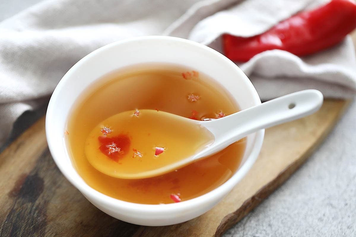 Authentic Vietnamese dipping sauce recipe with red chilies in a bowl.