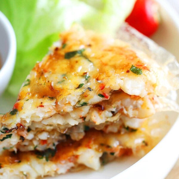 A stack of Vietnamese shrimp cakes on a plate.