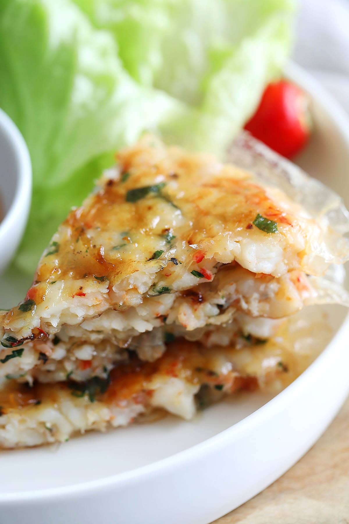 A stack of Vietnamese shrimp cakes on a plate.